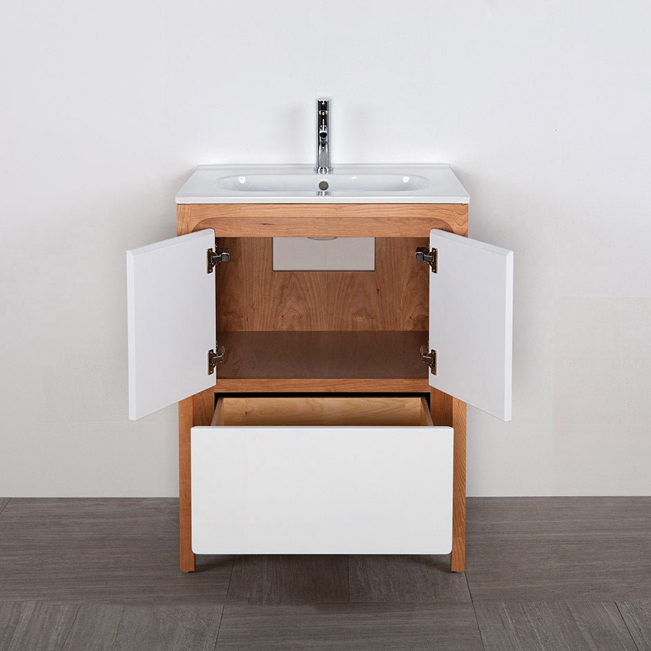 Free standing under counter vanity with routed finger pulls on two doors and one drawer. Bathroom Sink sold separately. Multi finish combinations are custom. W: 23 3/4", D: 17 3/4", H: 34" - Maison&Co.