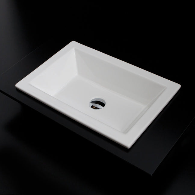 Self-rimming porcelain Bathroom Sink without an overflow. Unglazed exterior. W: 23 5/8”, D: 15 3/4", H: 5 1/2”