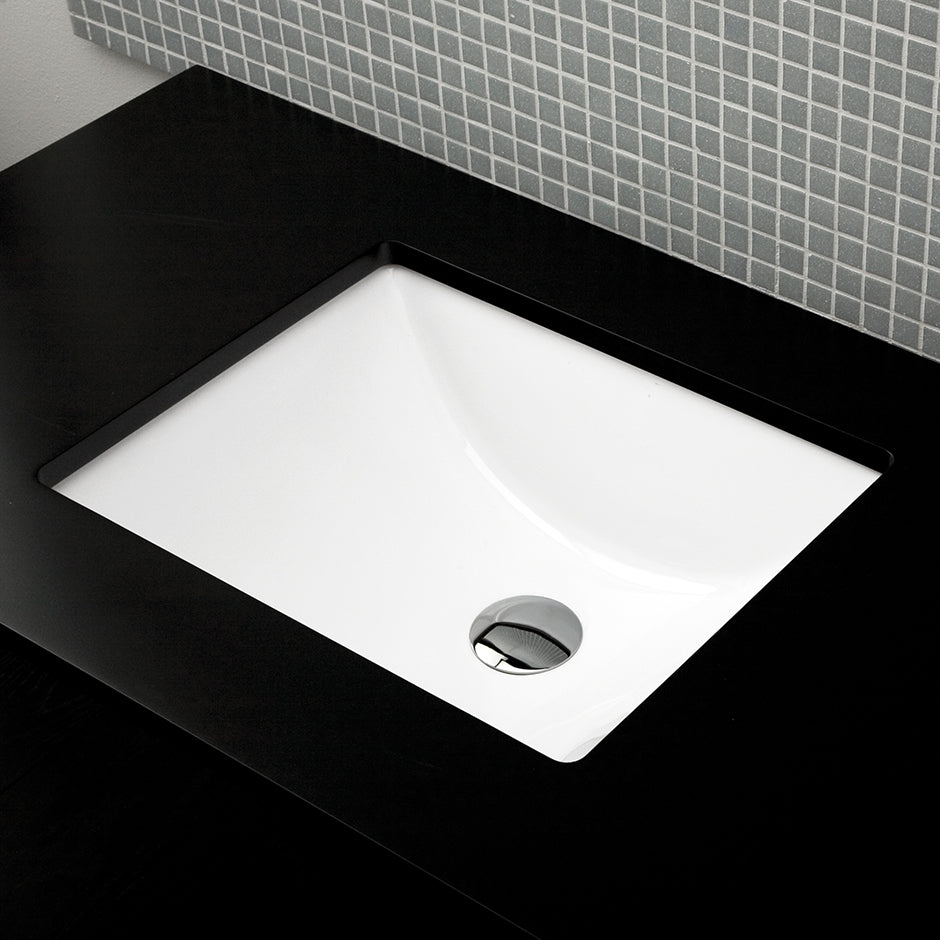 Under-counter porcelain Bathroom Sink with an overflow. Unglazed exterior. 19"W, 15"D, 8"H.