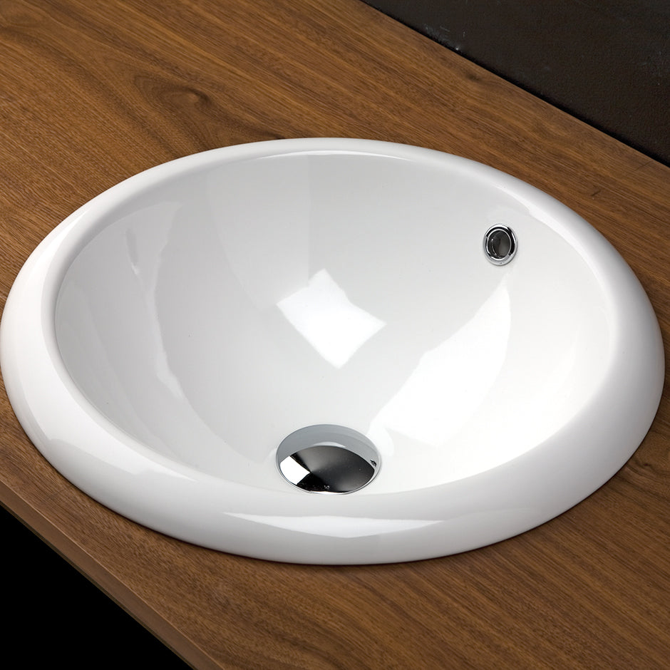 Self-rimming porcelain Bathroom Sink with an overflow. Unglazed bottom. 17 3/4" DIAM, 7 1/2"H