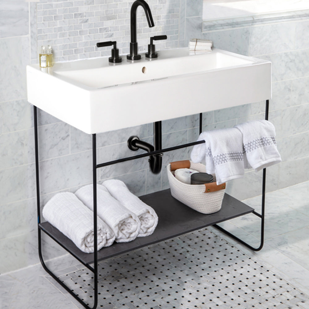 Floor-standing welded metal console stand with a towel bar and shelf. It must be attached to wall. Sink 5468 or vessel sink with countertop SUA-41T sold separately. W: 38-3/4", D: 18-1/8", H: 29". Matte Black