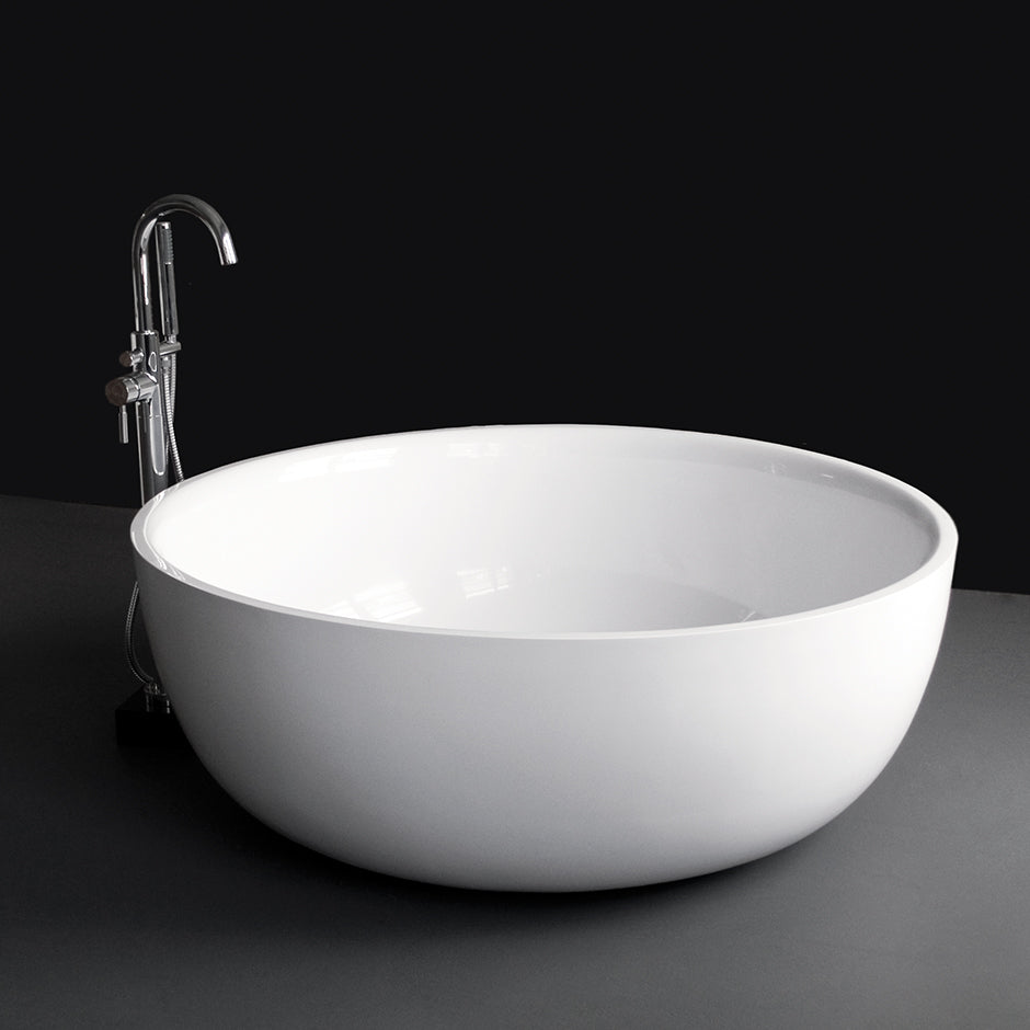 Free-standing soaking bathtub made of white solid surface with a decorative solid surface drain, no overflow, net weight 397 lbs, water capacity 122 gal. DIAM: 52 7/8” H: 19 1/2