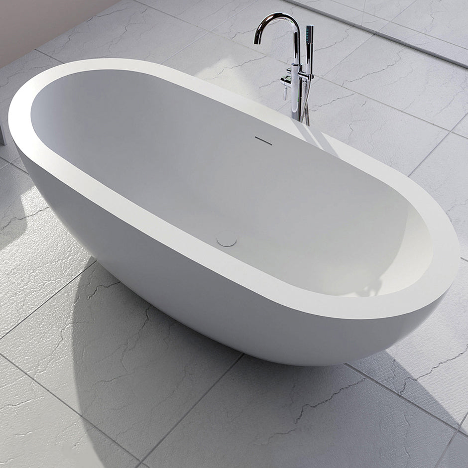 Free-standing soaking bathtub made of white solid surface with an overflow andndrain, net weight 364 lbs, water capacity 73 Gal.W: 70 7/8” D: 31 1/2” H: 23 5/8”