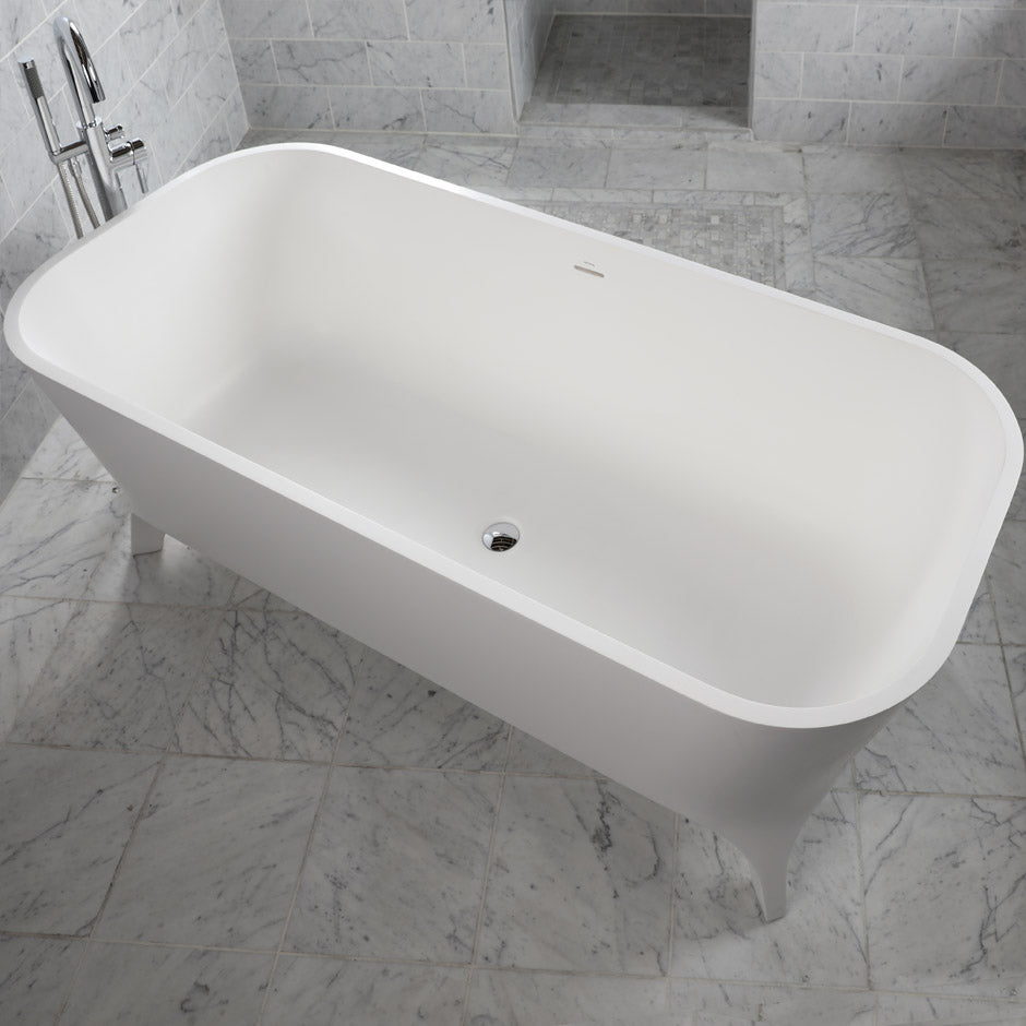 Free-standing soaking bathtub made of white solid surface with an overflow and a decorative solid surface drain; net weight 408 lbs, water capacity 91 gal. W: 70 7/8", D: 31 1/2", H: 23 5/8".